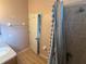 Bathroom featuring tub/shower combo, vanity and sink, towel rack, and neutral colors at 7055 Heatherbrook Dr, Lakeland, FL 33809