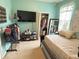 Well-decorated bedroom with bed, TV, and ample closet space at 7055 Heatherbrook Dr, Lakeland, FL 33809