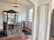 Cozy dining area with modern table set, display cabinet, and hardwood flooring at 7055 Heatherbrook Dr, Lakeland, FL 33809