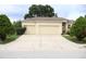 Charming single-Gathering home with a three-car garage and well-maintained landscaping at 7055 Heatherbrook Dr, Lakeland, FL 33809