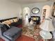 Elegant living room with hardwood floors, stylish furniture, and arched doorways at 7055 Heatherbrook Dr, Lakeland, FL 33809