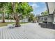 Backyard boasts a large deck with a dining table and seating, plus a storage shed at 3120 S Polk Ave, Lakeland, FL 33803