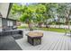 Spacious backyard features a patio with fire pit, seating, a basketball hoop and a playground at 3120 S Polk Ave, Lakeland, FL 33803