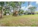 Backyard with a play structure and house in the background at 3120 S Polk Ave, Lakeland, FL 33803
