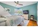 Brightly painted bedroom featuring hardwood floors, fan and large windows at 3120 S Polk Ave, Lakeland, FL 33803