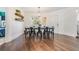 Dining area with modern lighting, wood floors, neutral wall color and a view to the outside at 3120 S Polk Ave, Lakeland, FL 33803