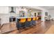 Modern kitchen features a large island with seating, stainless steel appliances, and stylish pendant lighting at 3120 S Polk Ave, Lakeland, FL 33803