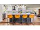 Modern kitchen featuring a large island with barstool seating, stainless appliances, and open layout to other rooms at 3120 S Polk Ave, Lakeland, FL 33803