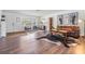 Charming living room featuring hardwood floors, decorative rug, and lots of natural light at 3120 S Polk Ave, Lakeland, FL 33803