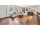 Bright living room featuring large windows, hardwood floors, and stylish decor at 3120 S Polk Ave, Lakeland, FL 33803