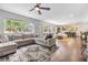 Spacious living room featuring an open layout, modern furnishings, and hardwood floors at 3120 S Polk Ave, Lakeland, FL 33803