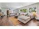 Bright living room with large windows, hardwood floors, and stylish furniture at 3120 S Polk Ave, Lakeland, FL 33803