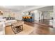 Open concept living space featuring a modern kitchen with a large island and a comfortable seating area at 3120 S Polk Ave, Lakeland, FL 33803