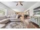 Bright living room featuring an open floor plan, stylish decor, and dark hardwood floors at 3120 S Polk Ave, Lakeland, FL 33803