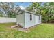 Backyard storage shed with roll up door, side door, and window at 3120 S Polk Ave, Lakeland, FL 33803
