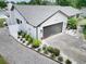 Aerial view of home, with garage, landscaping, and driveway at 4102 Stonehenge Rd, Mulberry, FL 33860