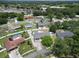 Aerial view of the community featuring many well-maintained properties, mature trees, and lush landscaping at 4102 Stonehenge Rd, Mulberry, FL 33860