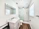 Bathroom featuring marble countertops, white cabinets and a glass shower at 4102 Stonehenge Rd, Mulberry, FL 33860