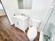 Bright bathroom featuring white countertops and a large toilet at 4102 Stonehenge Rd, Mulberry, FL 33860