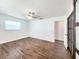 Light bedroom featuring wood floors, a ceiling fan and large closet at 4102 Stonehenge Rd, Mulberry, FL 33860