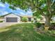 Charming single-story home featuring mature landscaping and a well-maintained front yard at 4102 Stonehenge Rd, Mulberry, FL 33860