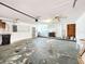 Spacious garage featuring a laundry area, ceiling fan and ample space for storage and vehicles at 4102 Stonehenge Rd, Mulberry, FL 33860