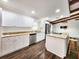 Updated kitchen boasting granite countertops, stainless steel appliances, and ample cabinet space at 4102 Stonehenge Rd, Mulberry, FL 33860