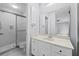 Bright bathroom with shower stall and single vanity, plus view into the main bedroom at 4160 Player Cir # 109, Orlando, FL 32808