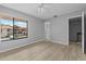 Well-lit bedroom with light flooring, ceiling fan, and view out the window at 4160 Player Cir # 109, Orlando, FL 32808