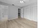 Spacious bedroom featuring light colored vinyl floors, ceiling fan, and two closets at 4160 Player Cir # 109, Orlando, FL 32808
