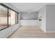 Bright dining room with hardwood floors, built-in storage, and large window views at 4160 Player Cir # 109, Orlando, FL 32808
