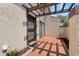 Charming brick-paved courtyard entrance with pergola offering shade and style at 4160 Player Cir # 109, Orlando, FL 32808