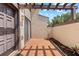 This home features a private front porch with brick pavers and shade provided by a pergola above at 4160 Player Cir # 109, Orlando, FL 32808