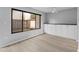 Bright living room with large window and built-in white cabinets, offering ample natural light and storage space at 4160 Player Cir # 109, Orlando, FL 32808