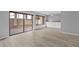 Bright and airy living room with sliding glass doors, modern flooring, and built-in cabinets, maximizing space and light at 4160 Player Cir # 109, Orlando, FL 32808