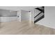 Inviting living room with light wood floors, white built-in cabinets, and a modern staircase, perfect for entertaining at 4160 Player Cir # 109, Orlando, FL 32808