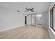 Bright main bedroom with light-colored floors, ceiling fan, sliding door mirrored closet, and en suite bathroom at 4160 Player Cir # 109, Orlando, FL 32808