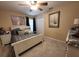 Cozy bedroom with an inviting bed, neutral walls, tile flooring, and a closet for storage at 4471 Marsh Harbor Dr, Tavares, FL 32778