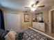 Comfortable bedroom with a bed, ceiling fan, neutral walls, tile flooring, and a closet at 4471 Marsh Harbor Dr, Tavares, FL 32778