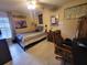Inviting bedroom with a comfortable bed, a ceiling fan, tile flooring, and a desk area for studying at 4471 Marsh Harbor Dr, Tavares, FL 32778