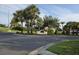 Community entrance with mature landscaping, signage and a street crossing at 4471 Marsh Harbor Dr, Tavares, FL 32778