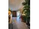 Bright foyer with tile flooring, decorative plants, and an archway leading to the living area at 4471 Marsh Harbor Dr, Tavares, FL 32778