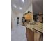 Bright kitchen with granite counters, stainless appliances, and a view into the breakfast nook at 4471 Marsh Harbor Dr, Tavares, FL 32778
