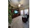 Spacious living room with tile flooring, vaulted ceilings, and a large entertainment center at 4471 Marsh Harbor Dr, Tavares, FL 32778
