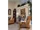 Cozy sitting area features a comfortable chair, stylish decor, and lush indoor plants at 4471 Marsh Harbor Dr, Tavares, FL 32778