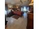 Spacious main bedroom with a large bed, tile flooring, and large windows for lots of natural light at 4471 Marsh Harbor Dr, Tavares, FL 32778