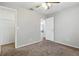 Cozy bedroom featuring a ceiling fan, neutral walls and an open closet at 6125 Morningdale Ave, Lakeland, FL 33813