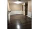 Bright living room boasts a seamless flow with beautiful laminate flooring and neutral paint at 6125 Morningdale Ave, Lakeland, FL 33813