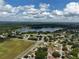 Community aerial view showcasing the lake and neighborhood, offering a scenic environment at 17 Oak Loop, Ocala, FL 34472