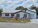 Charming single-story home featuring fresh exterior paint, new roof and meticulously maintained landscaping at 17 Oak Loop, Ocala, FL 34472